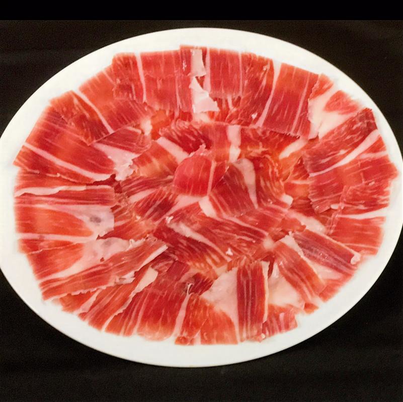 jambon-pata-negra-bellota-coupe-main